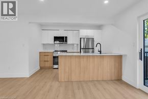 Woodstock apartment for rent - A modern kitchen with wooden cabinets and stainless steel appliances.