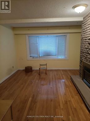 Mississauga (Erin Mills) apartment for rent - A room with wooden flooring and a window with blinds.
