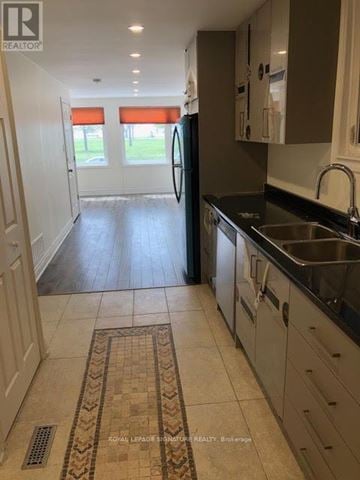 Toronto (The Beaches) apartment for rent - A kitchen with a sink and a refrigerator.