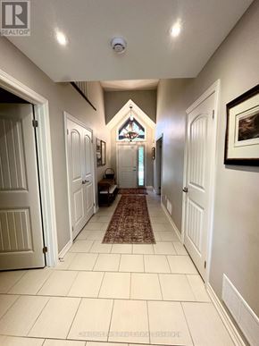 Collingwood townhouse for rent - A hallway with white doors and a brown rug.