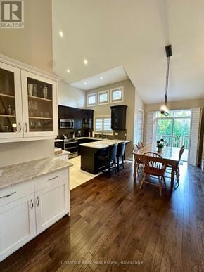 Collingwood townhouse for rent - A well-lit kitchen with dark wood floors and white cabinets.