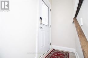 Ottawa apartment for rent - A white door with a window in the middle of it.