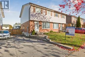 Oshawa (Donevan) apartment for rent - A residential building with a sign in front of it.