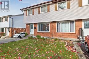 Oshawa (Donevan) apartment for rent - A house with a garden in front of it.