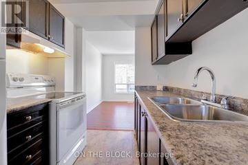 Brampton (Bramalea West Industrial) townhouse for rent - A kitchen with a white oven and a sink.