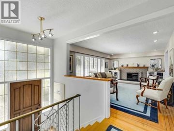 Vancouver apartment for rent - A living room with a fireplace and a dining table.
