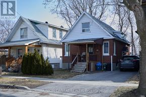 Oshawa (O'neill) apartment for rent - A house with a car parked in front of it.