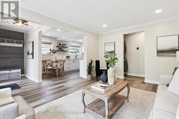 Halton Hills (Georgetown) apartment for rent - A modern living room with a white sofa and a wooden coffee table.