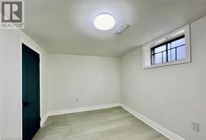 Hamilton apartment for rent - A room with a window and a light on the ceiling.