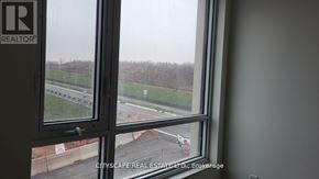 Guelph (Willow West/Sugarbush/West Acres) condo for rent - A window with a view of a construction site and a white van.