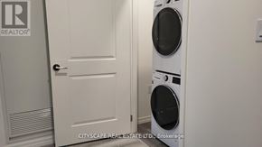 Guelph (Willow West/Sugarbush/West Acres) condo for rent - A white door with a Realtor sign on it.