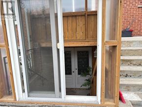 Toronto (Steeles) apartment for rent - A white door is open to a room with a wooden interior.