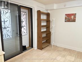 Toronto (Steeles) apartment for rent - A room with a sliding door, a shelf, and a painting on the wall.