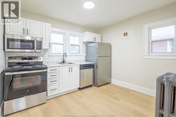 Windsor apartment for rent - A kitchen with white cabinets and stainless steel appliances.