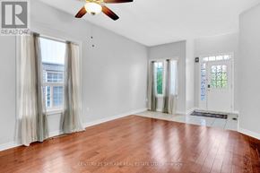 Bradford West Gwillimbury (Bradford) apartment for rent - A room with wooden floors and a ceiling fan.