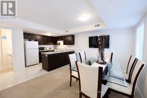 Asphodel-Norwood (Norwood) townhouse for rent - A modern kitchen with a dining table set for four.