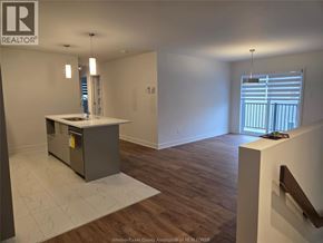 Clarence-Rockland apartment for rent - A room with a kitchen island and wooden flooring.