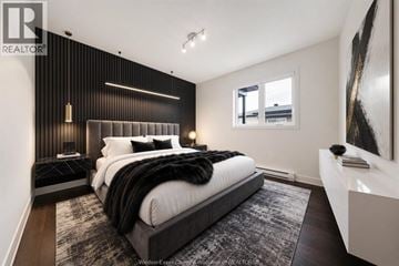 Clarence-Rockland apartment for rent - A bedroom with a large bed and a painting on the wall.
