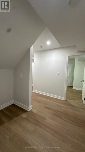 Toronto (Weston) apartment for rent - A room with wooden flooring and white walls.