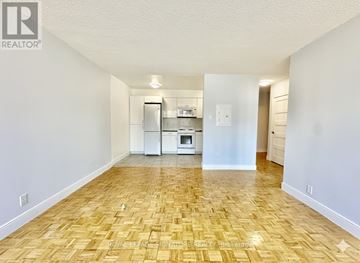 Toronto (Yonge-Eglinton) condo for rent - A kitchen area with a refrigerator, microwave, and oven.