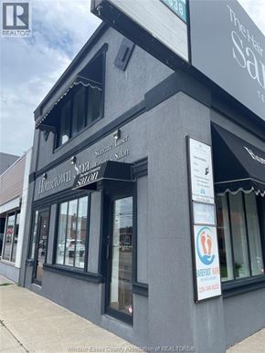 Tecumseh apartment for rent - A building with a sign that says Hometown Salon.