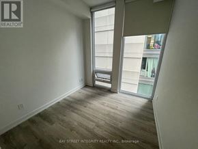Toronto (Church-Yonge Corridor) condo for rent - A room with a sliding glass door leading to a balcony.