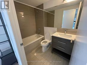 Toronto (Church-Yonge Corridor) condo for rent - A small bathroom with a toilet, sink, and bathtub.