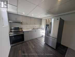 Pickering (Woodlands) apartment for rent - A kitchen with a refrigerator, oven, and sink.