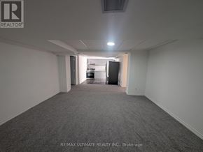 Pickering (Woodlands) apartment for rent - A brokerage office with a carpeted floor and white walls.