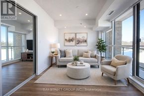 Toronto (West Hill) condo for rent - A living room with a couch, chair, and coffee table.