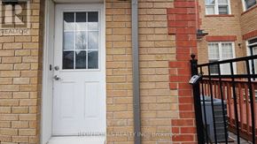 Markham (Cornell) apartment for rent - A white door with a glass window is on a brick wall.