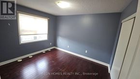 Markham (Cornell) apartment for rent - A room with a window and a wooden floor.