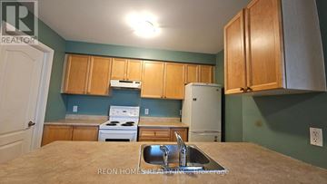 Markham (Cornell) apartment for rent - A kitchen with a stove, sink, and cabinets.