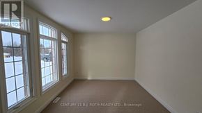 Oro-Medonte (Sugarbush) apartment for rent - A room with a window and a sign that says "REALTOR".