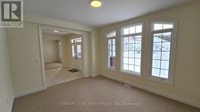 Oro-Medonte (Sugarbush) apartment for rent - A room with a carpet floor, a door, a window and a wall.