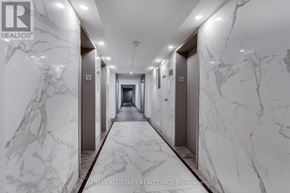 Toronto (Steeles) condo for rent - A marble hallway with the RE/MAX All-Stars Realty logo on the wall.
