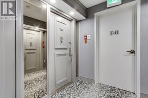 Toronto (Steeles) condo for rent - A hallway with doors numbered 5-12.