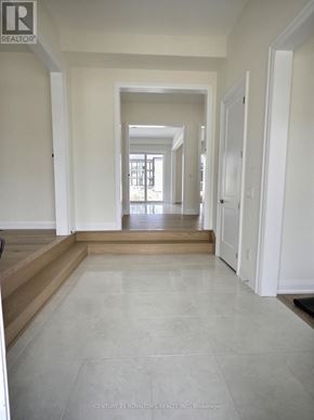 Oro-Medonte apartment for rent - A long hallway with white walls and tile flooring.