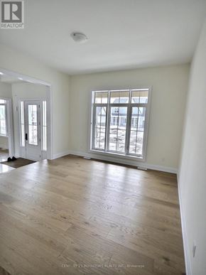 Oro-Medonte apartment for rent - A room with a window and wooden floors.