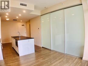 Burnaby apartment for rent - A modern kitchen with a sink and a countertop.