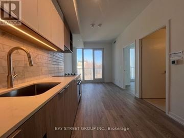 Toronto (Humewood-Cedarvale) condo for rent - A kitchen with a sink and a window.