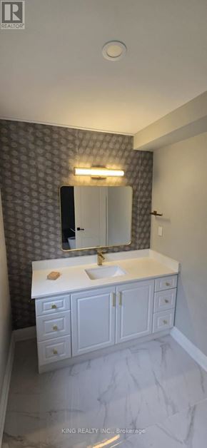 Brampton (Credit Valley) apartment for rent - A bathroom with a white countertop and a mirror above it.