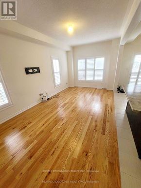 Pickering apartment for rent - A room with wooden flooring and white walls.