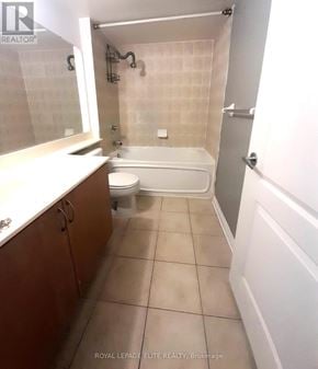 Mississauga (City Centre) condo for rent - A white bathtub is in a bathroom with white walls and a white toilet.