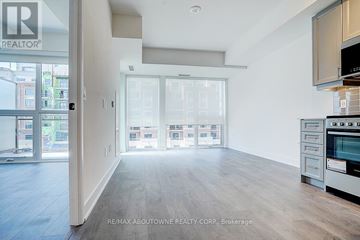 Oakville (Wm Westmount) condo for rent - A spacious kitchen with a stove top oven and microwave.