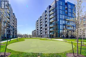 Oakville (Wm Westmount) condo for rent - A large green lawn in front of apartment buildings.
