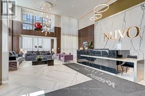 Oakville (Wm Westmount) condo for rent - A modern office lobby with a reception desk and seating areas.