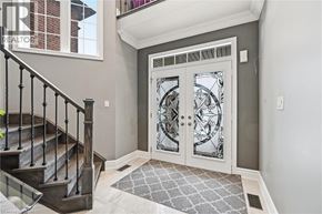 Ancaster apartment for rent - A foyer with a staircase and a glass door.