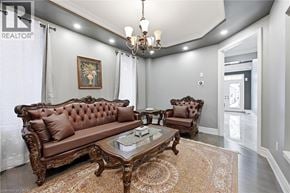 Ancaster apartment for rent - A living room with a brown sofa and a glass coffee table.