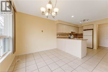 Kitchener apartment for rent - A spacious kitchen with a white countertop and cabinets.
